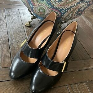 Nine West Black patent leather pumps with strap and gold tone buckle